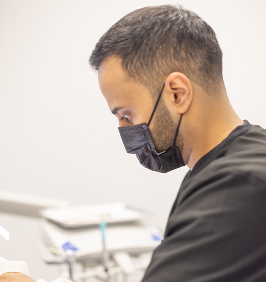 Dentist talking to dental patient