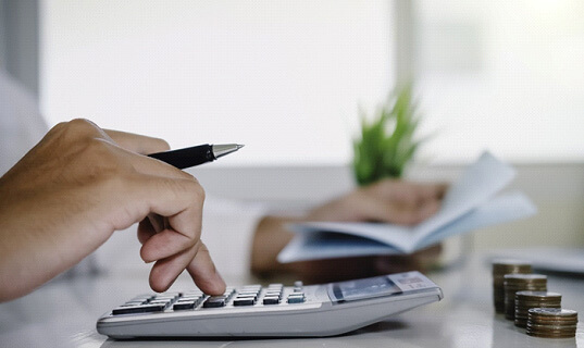 man using a calculator