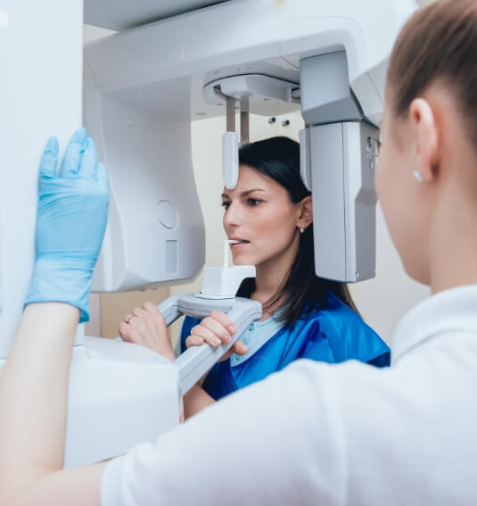 Woman receiving 3 D cone beam imaging scans