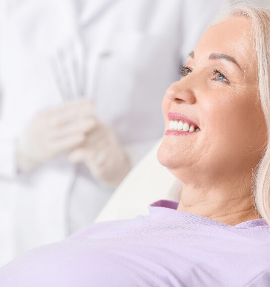 Woman with dental implants smiling