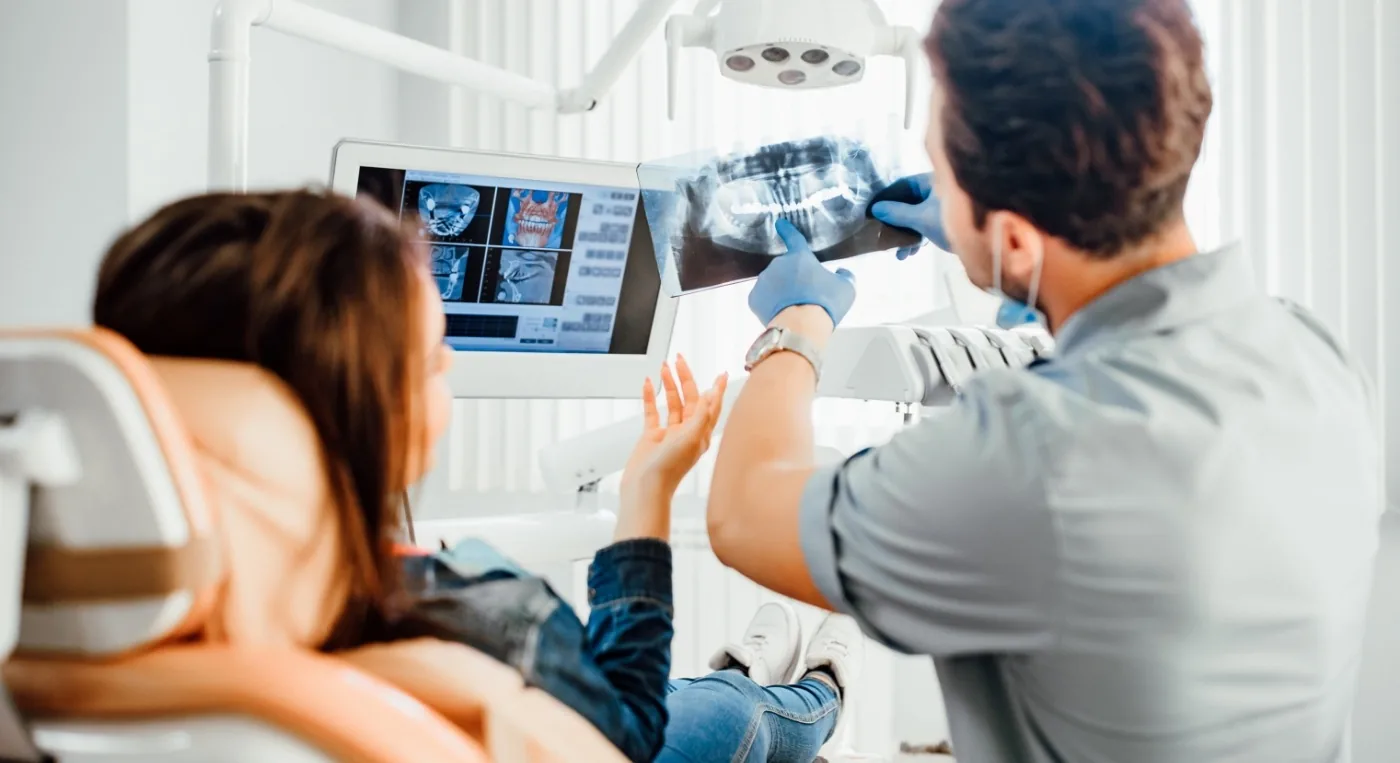 Des Plaines dentist showing a patient x rays of their teeth