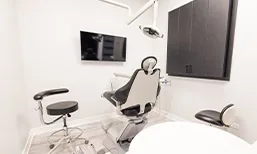 Dental exam room with sleek white walls