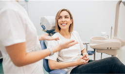 Woman in dental chair smiling at her dentist in Des Plaines Illinois