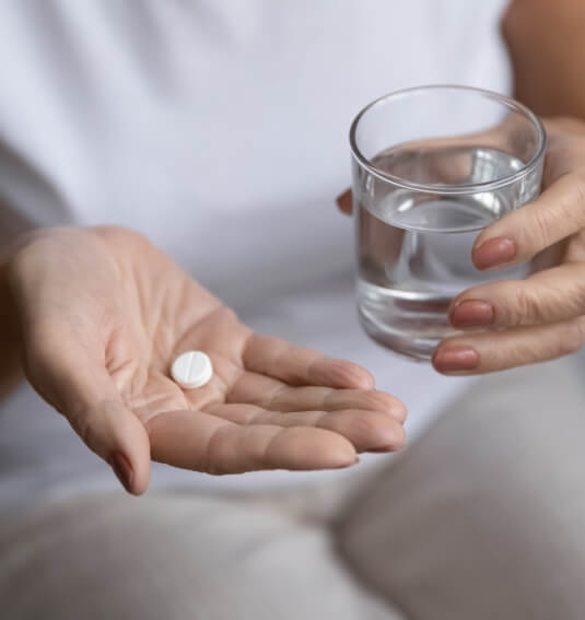 Dental patient taking antibiotic therapy pill