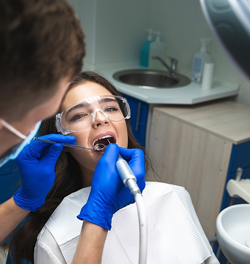Woman in dental chair undergoing root canal