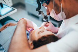 Dentist working on young patient. 