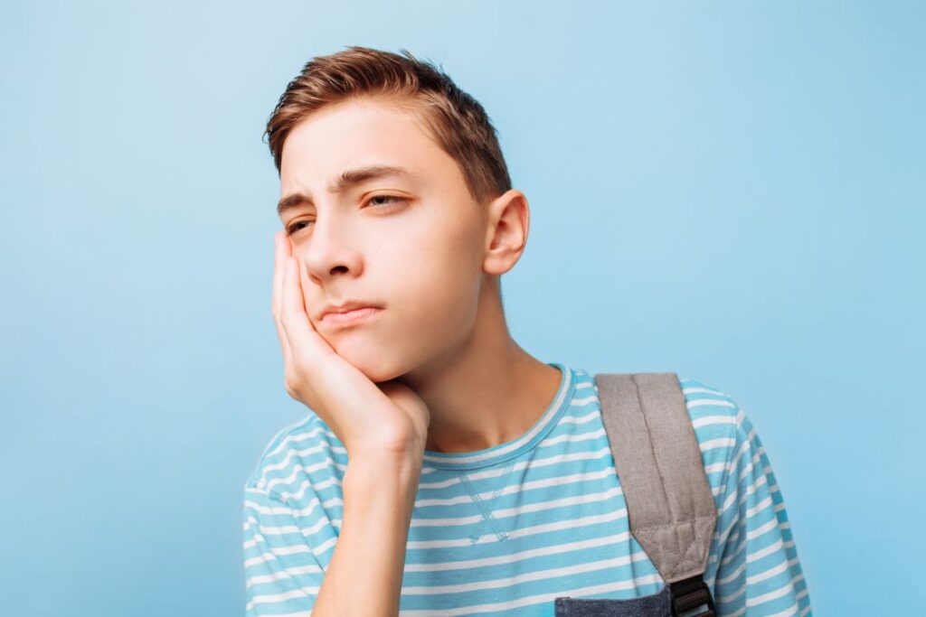 A teenage boy with a toothache